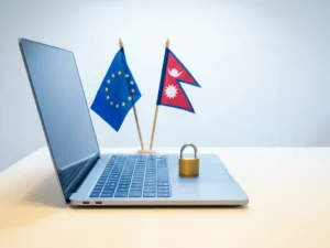 Open laptop on a white desk with EU and Nepalese flags beside a closed padlock symbolizing cross-border data compliance.